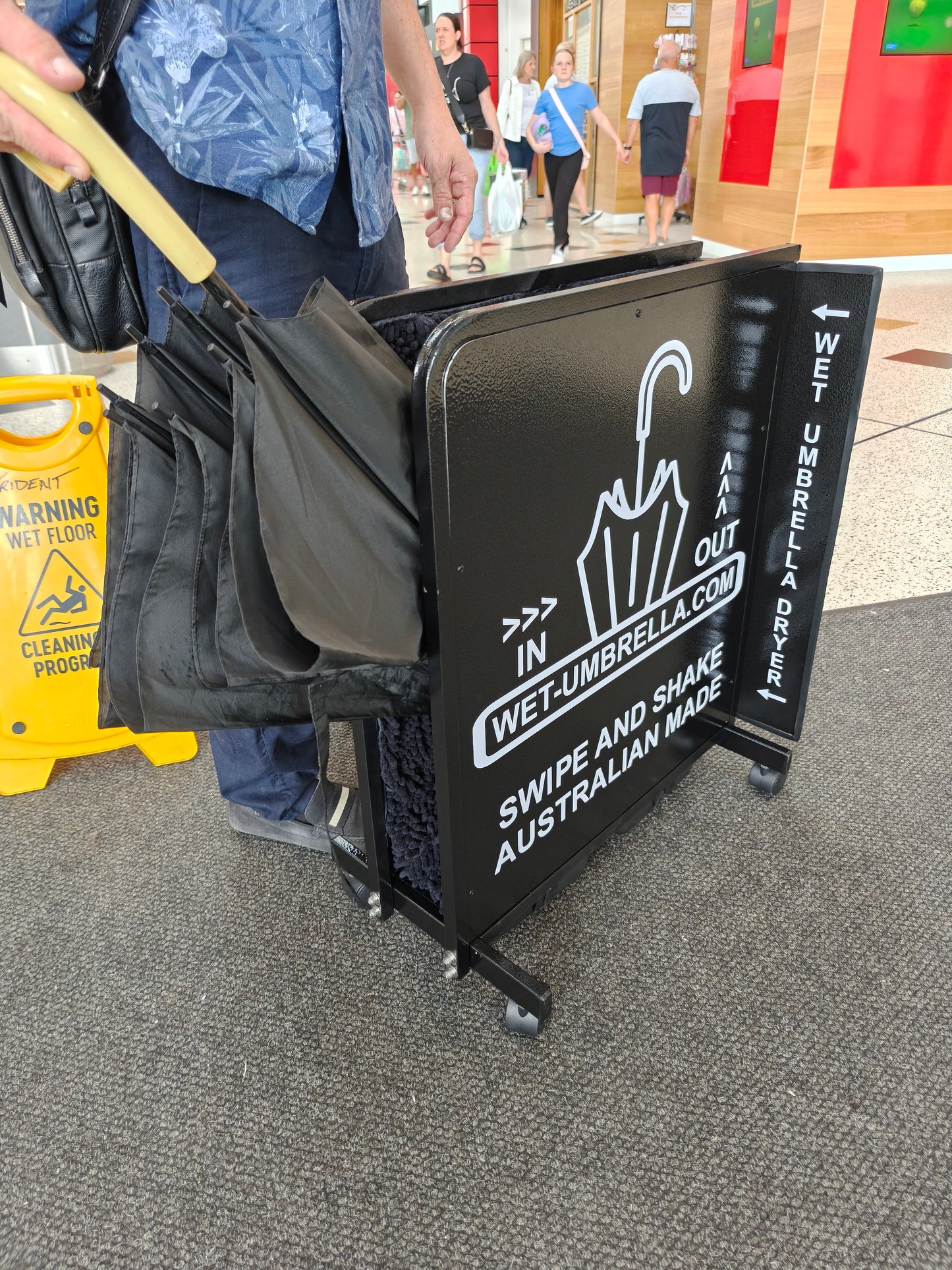 Insert Wet Umbrella into umbrella Dryer